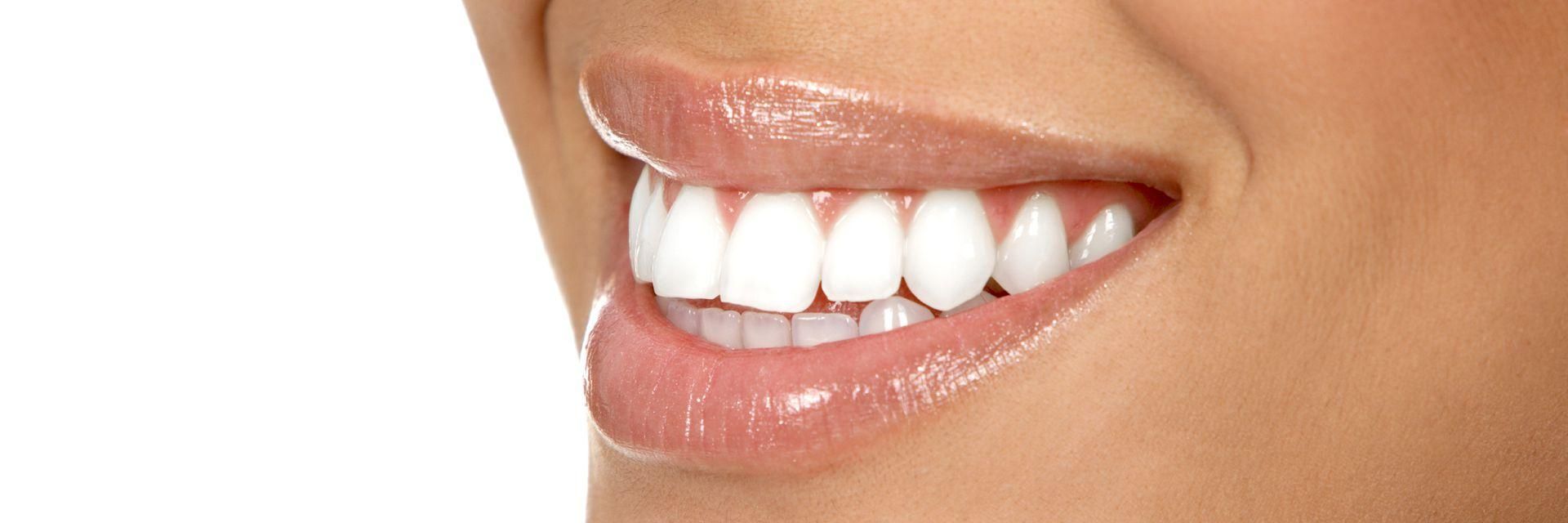 The radiant smile of a woman with healthy brown skin