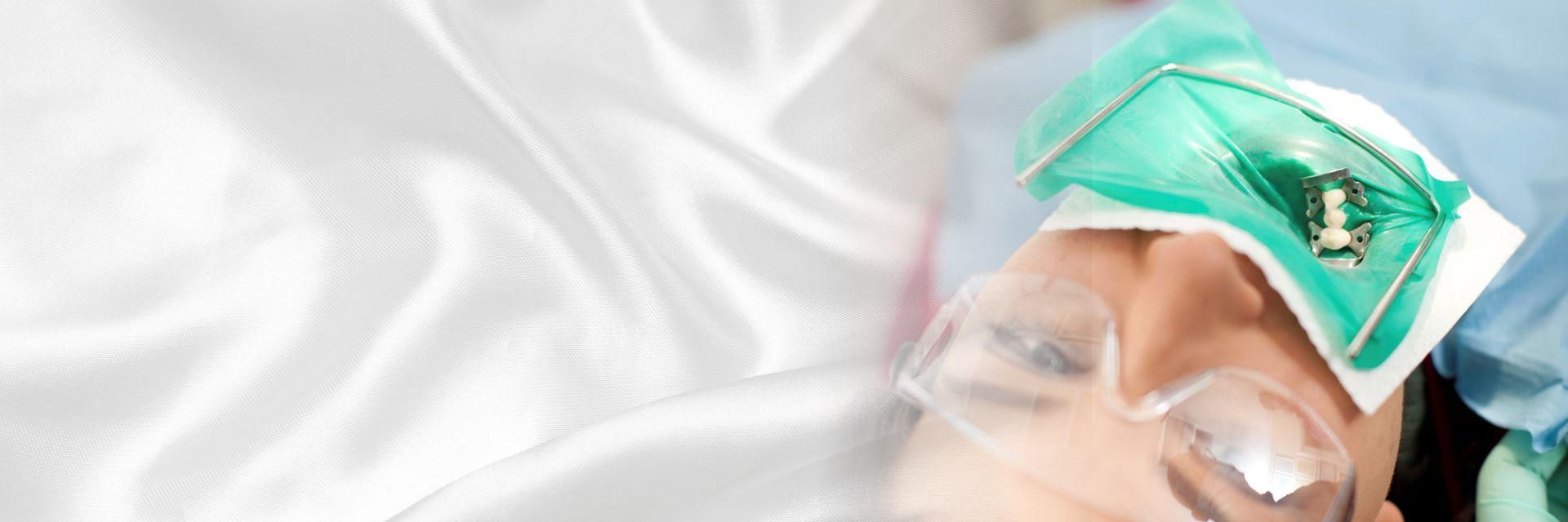 A customer undergoing treatment in a dentist's chair